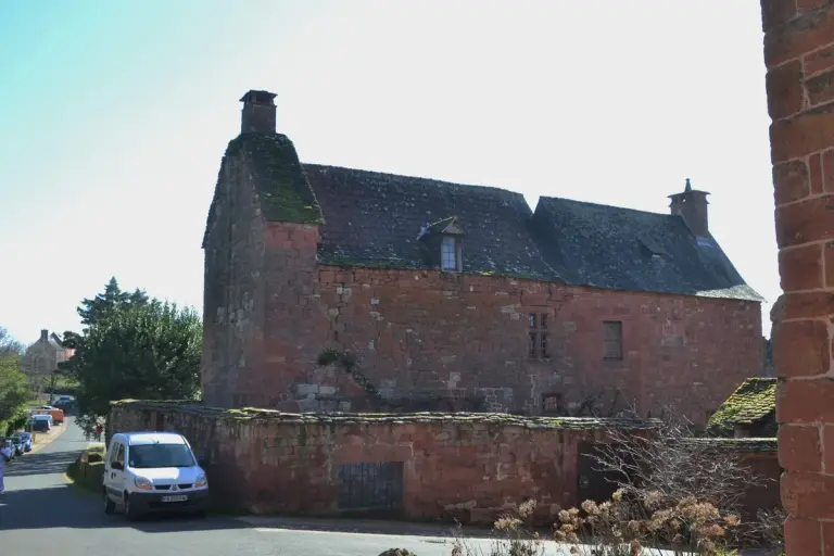 A red sandstone house in Collonges-la-Rouge, behind the church