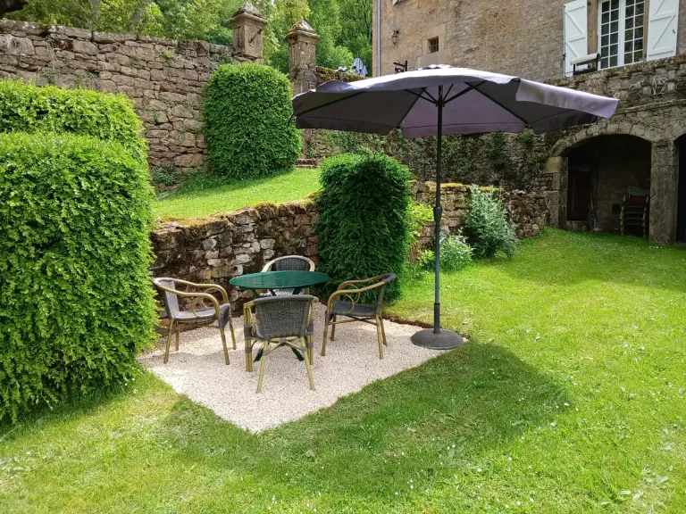 Outdoor seating for Gilles del Bosc by the walled garden