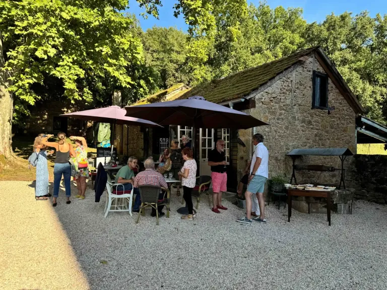 Guests under the parasols at the tea garden
