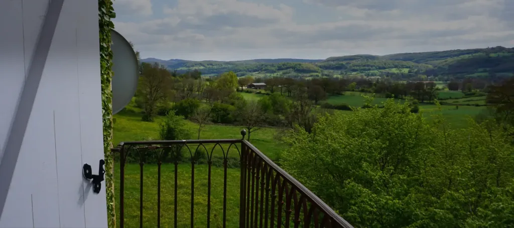 View from the château over the valley, with woods and rolling meadows